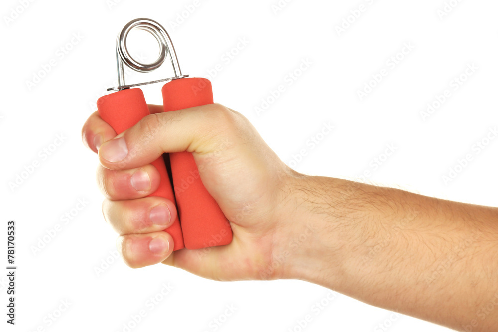 Hand trainer with steel spring in male hand, isolated on white Hand trainer with steel spring in male hand, isolated on white