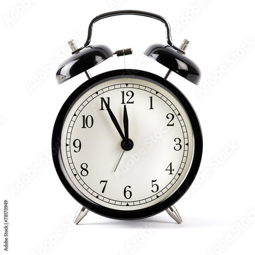 Black alarm clock isolated on white with shadow