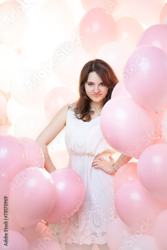 beautiful girl in a large number of pink and white balloons © ksi