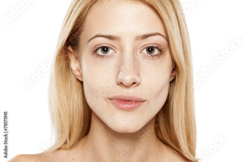 portrait of serious young blonde without make up