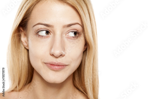 portrait of positive young blonde without make up