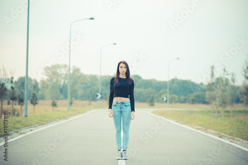young beautiful brunette straight hair woman on the road