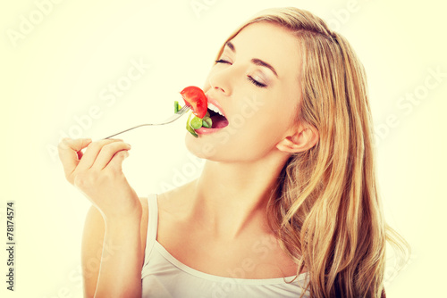 Smiling woman eating salat