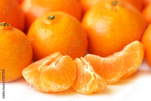 Tangerine slices and whole tangerines