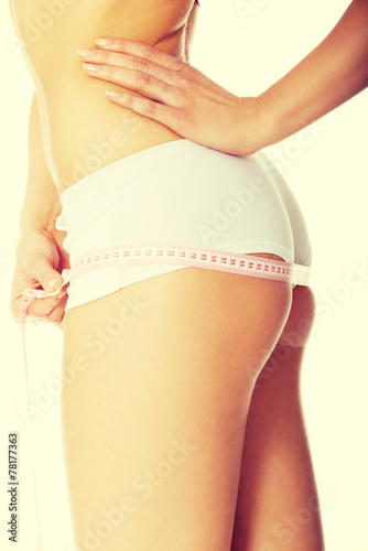 Woman measuring perfect body.