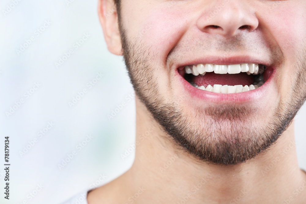 Smiling young man after visit dentist Smiling young man after visit dentist