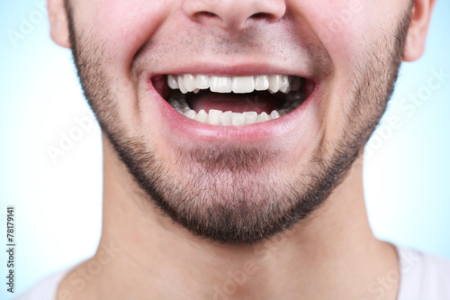Smiling young man after visit dentist