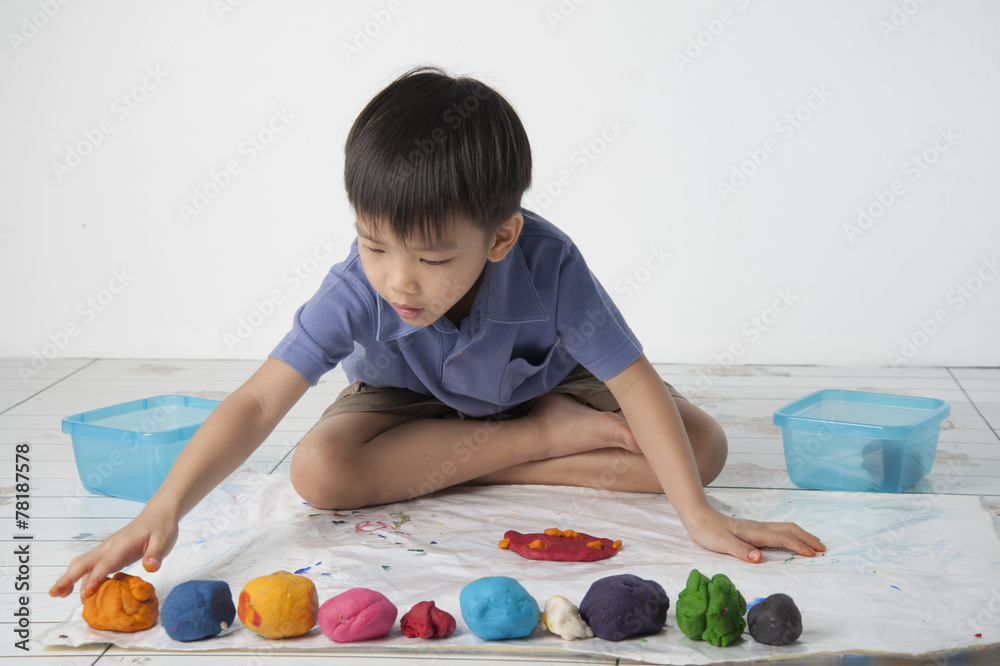 Fototapeta premium Boy play dough