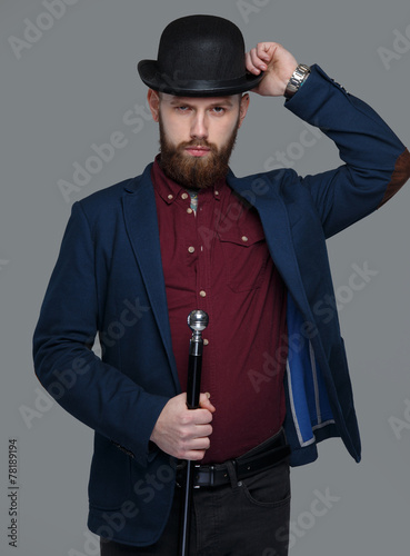 Tattooed male in blue costume