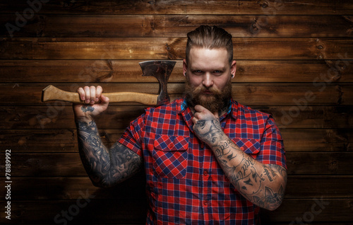 Strict brutal huge male with beard and axe