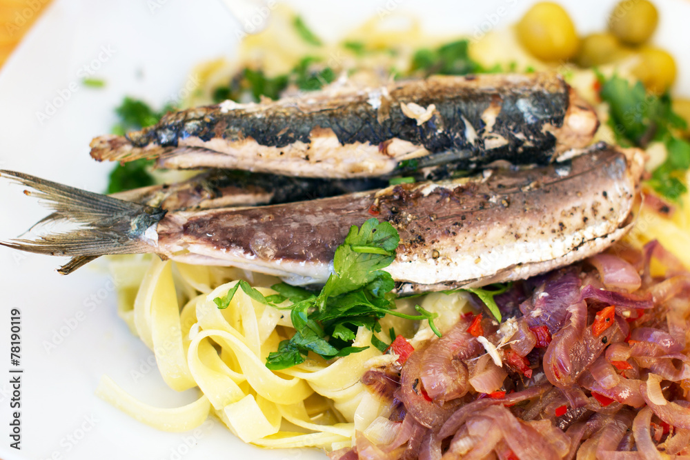 Dish of fish with spaghetti