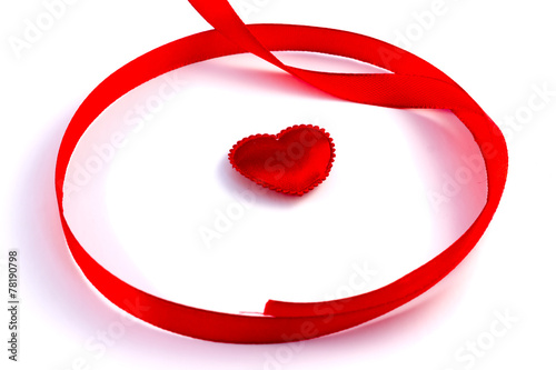 Red tape loop with small heart on a white background