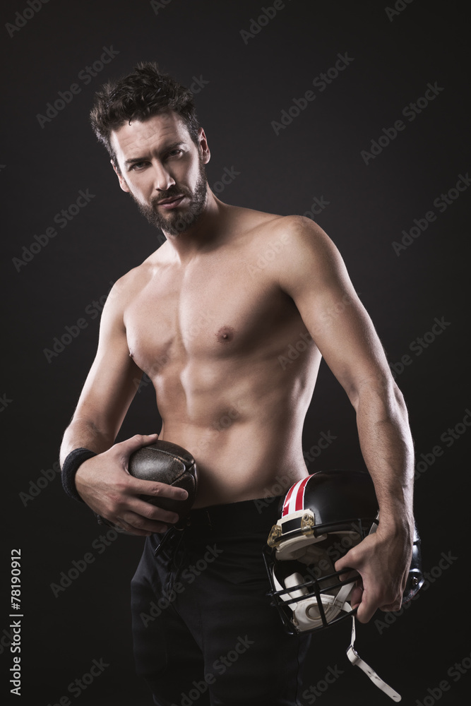 Shirtless football player with helmet