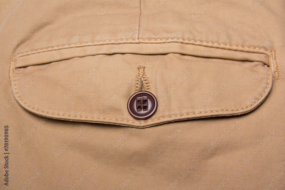 close up of brown pants back pocket close up of brown pants back pocket