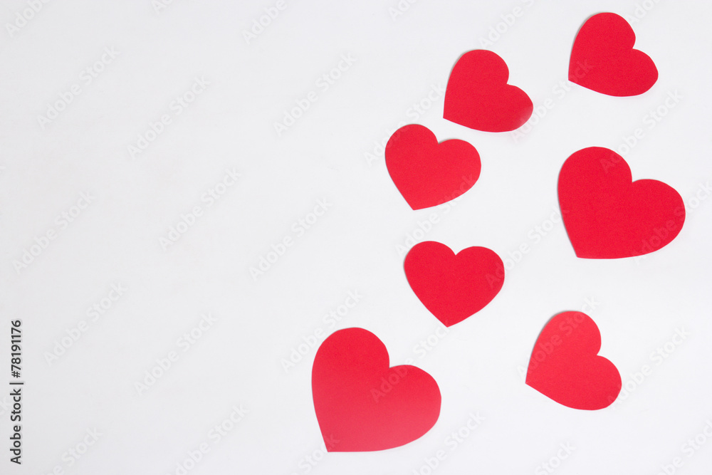 red paper hearts over white with copy space