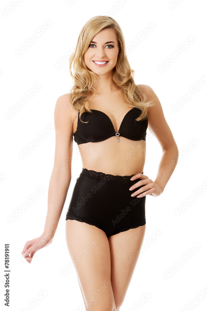 Fototapeta premium Happy young woman in lingerie