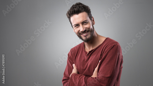 Confident man posing on gray background