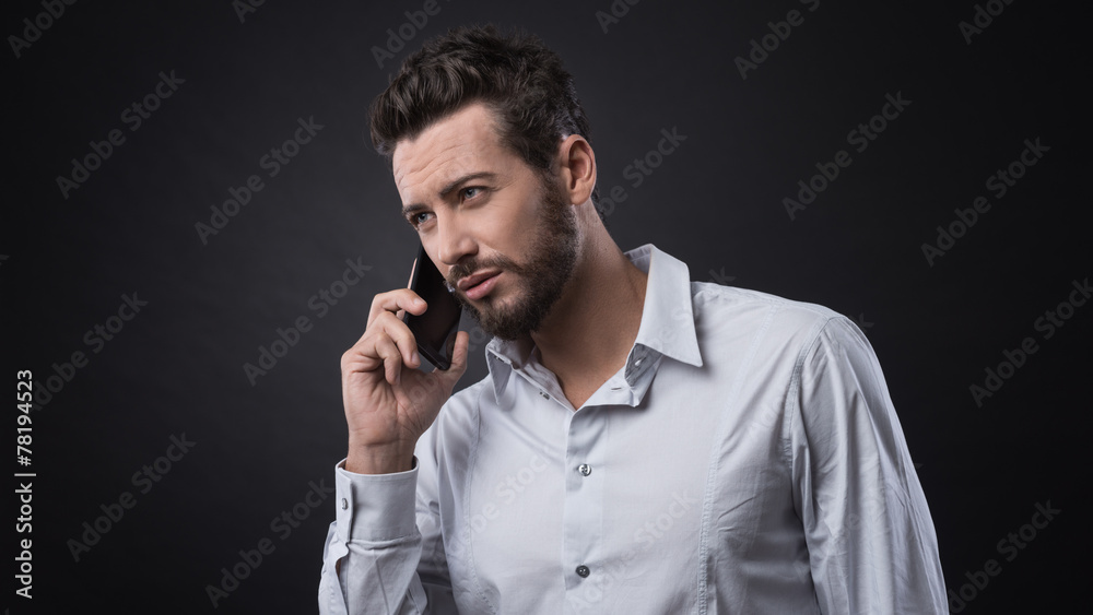 Young businessman having a phone call Young businessman having a phone call