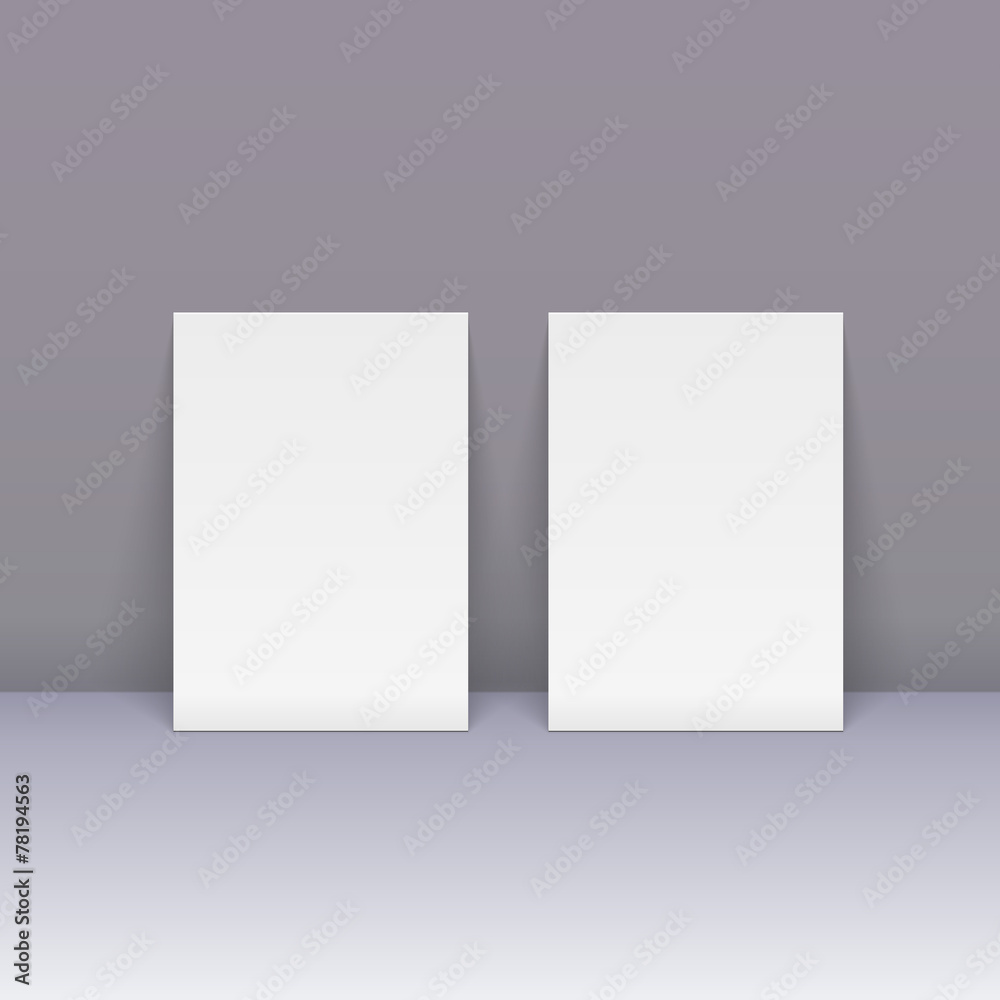 Sheets of blank paper beside the wall
