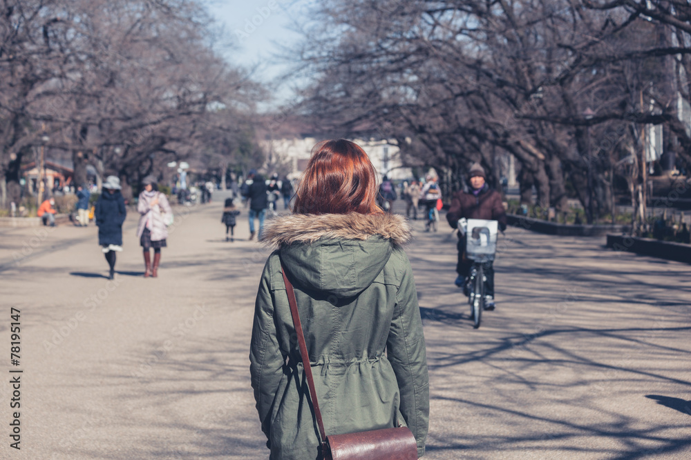 Fototapeta premium Woman walking in Ueno Park