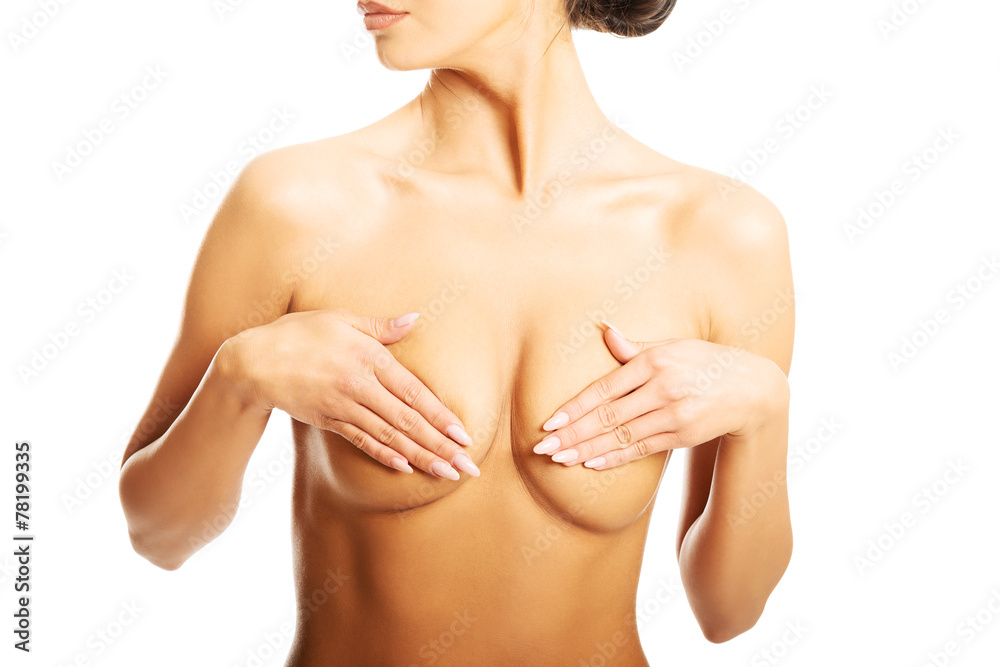 Beautiful nude woman covering her breast Beautiful nude woman covering her breast