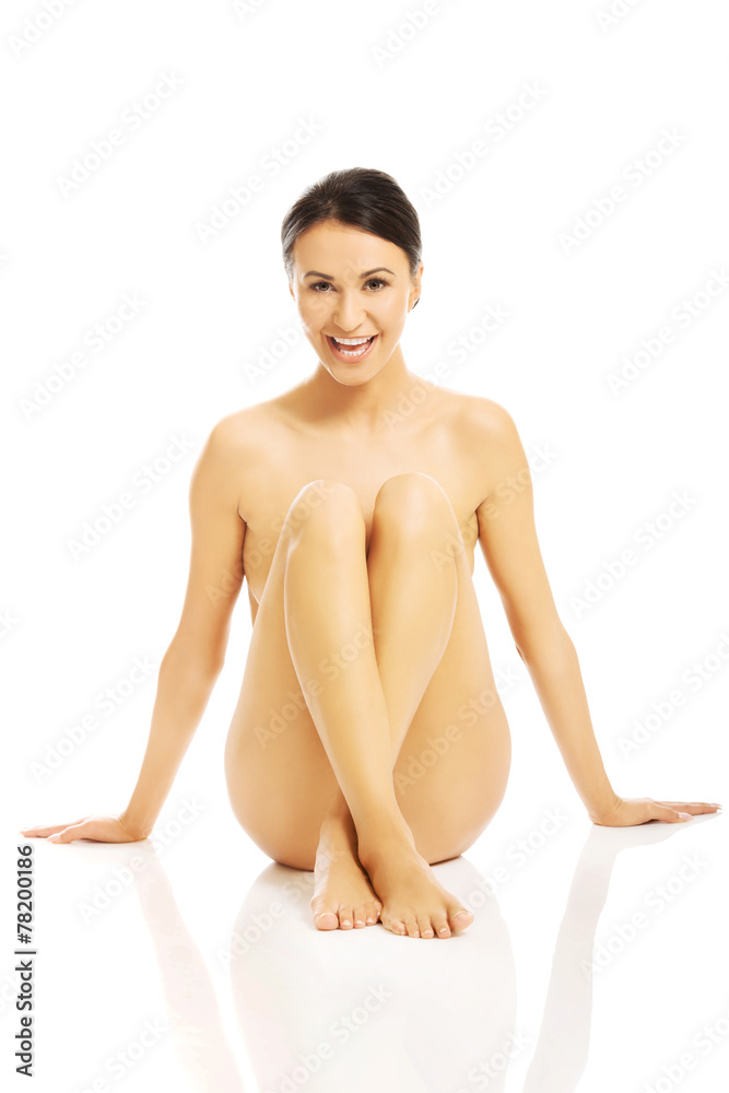 Front view nude woman sitting, propping up floor Front view nude woman sitting, propping up floor