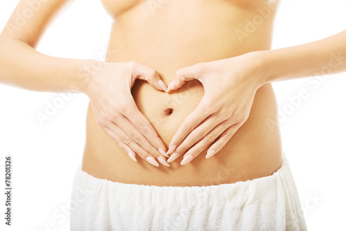 Wallpaper Mural Close up female making heart shape on belly Torontodigital.ca