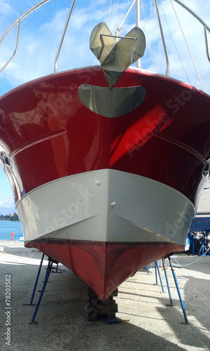 red Motor Boat Maintenance on land 