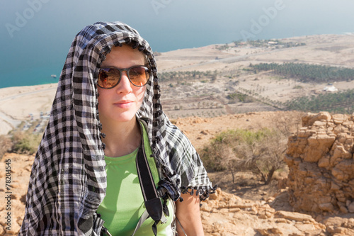 Young woman wearing kafia portrait. photo