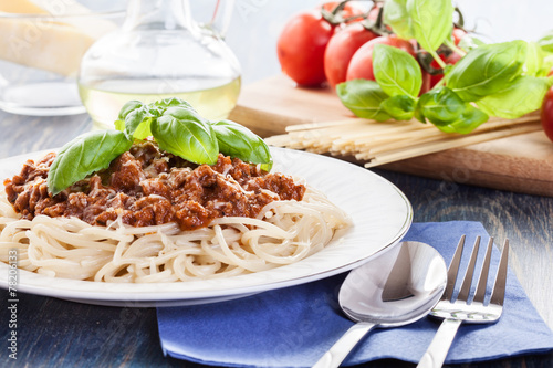 Spaghetti bolognese with cheese and basil