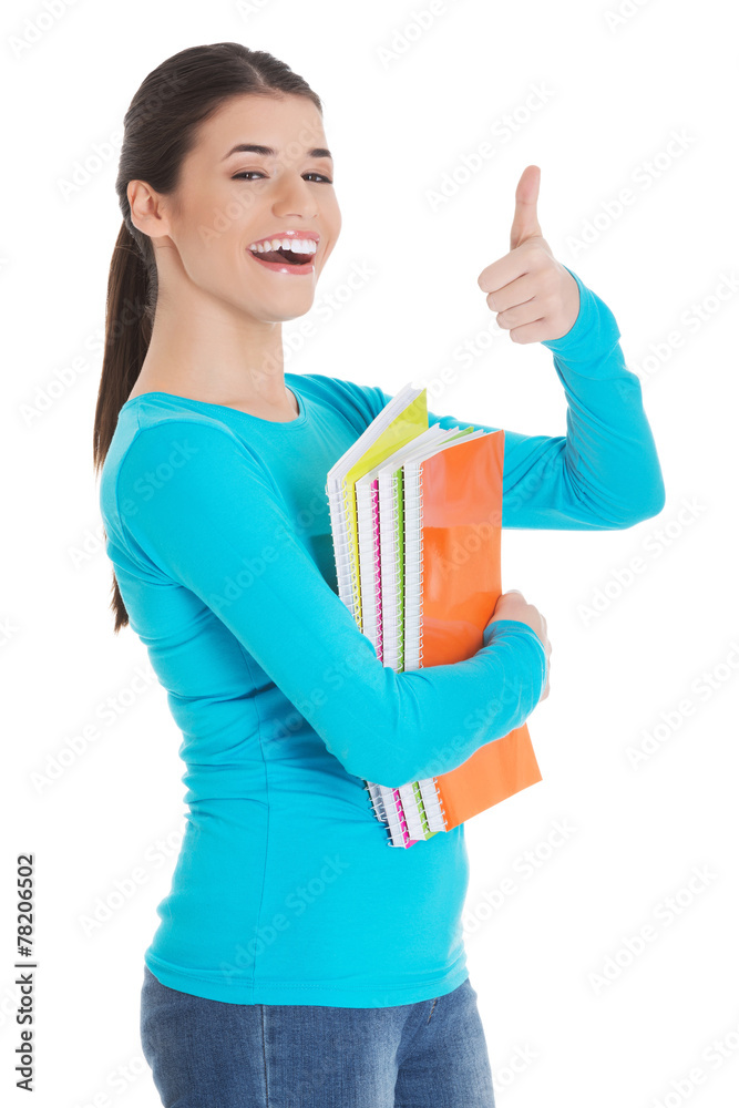 Portrait of woman holding notes showing thumbs up Portrait of woman holding notes showing thumbs up