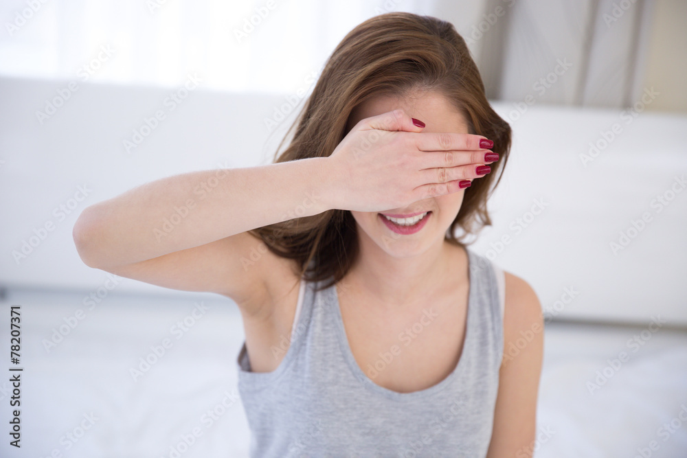 Young happy woman with closed eyes by hand Young happy woman with closed eyes by hand