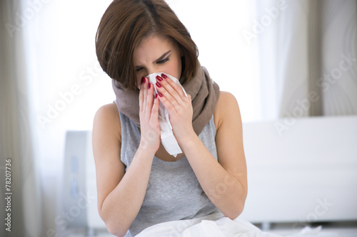 Sick Woman. flu. woman caught cold. sneezing into tissue