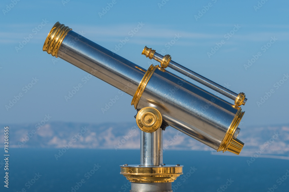 Old golden sightseeing telescope in Marseille, France