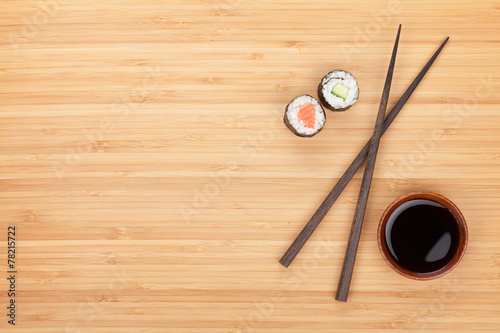 Maki sushi, chopsticks and soy sauce