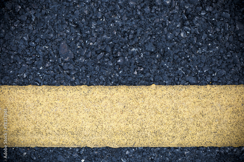 Fototapeta premium Yellow line on road texture