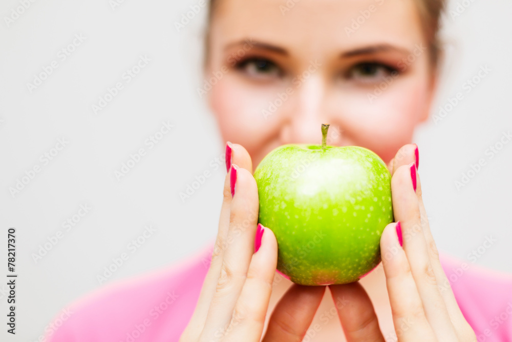 Close up of woman with green apple Close up of woman with green apple