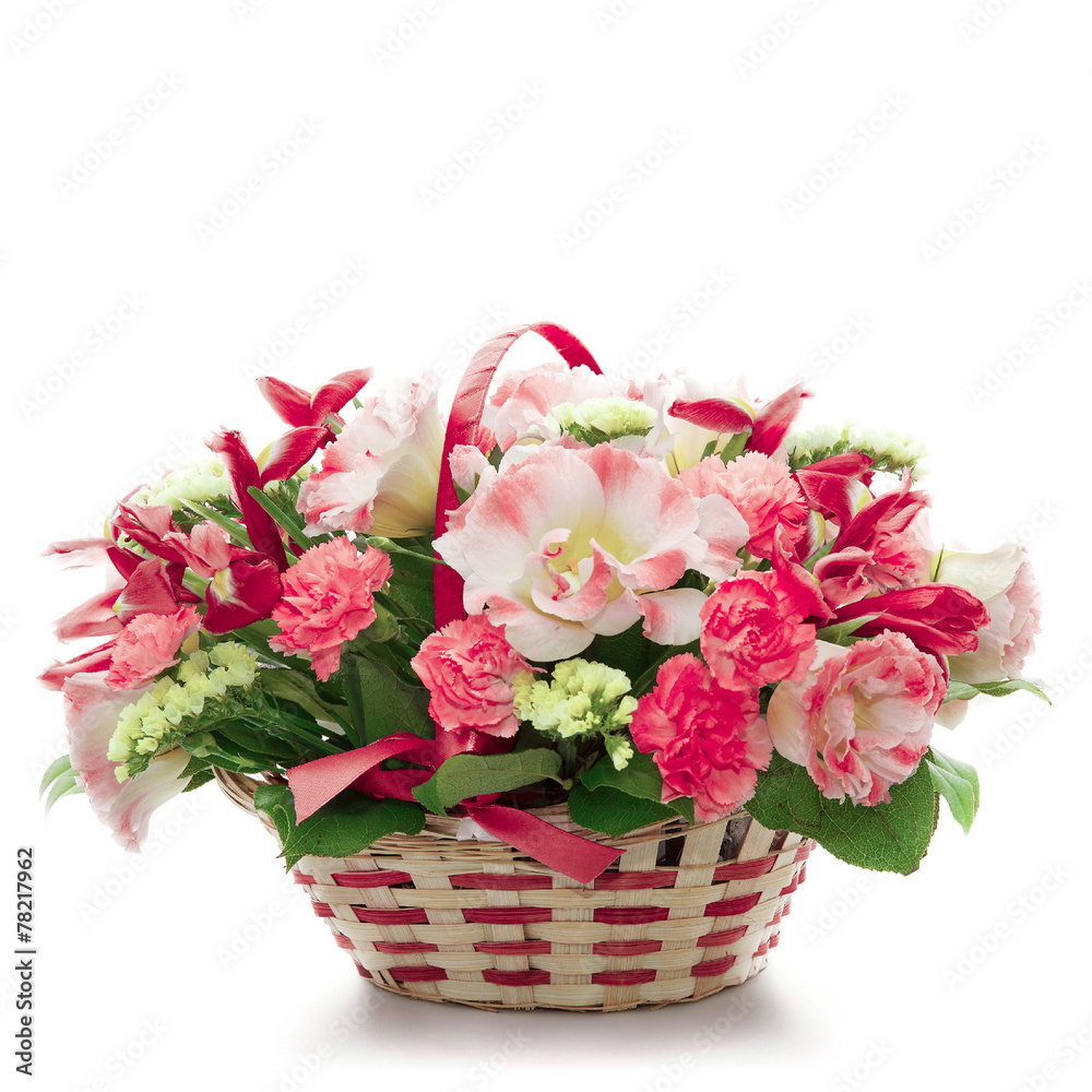Beautiful flowers in a basket isolated on white