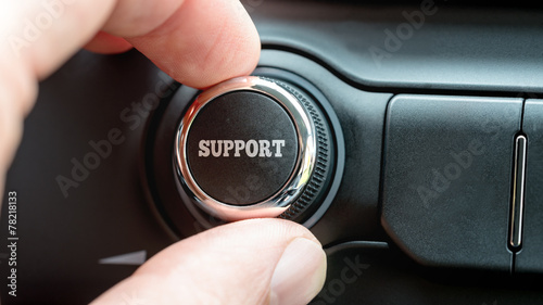 Man turning a dial with the word Support