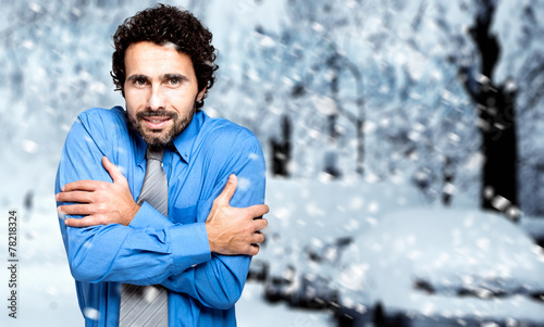 Slika na platnu Portrait of a frozen businessman in the cold winter