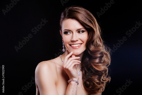 portrait of a beautiful brunette girl with luxury accessories