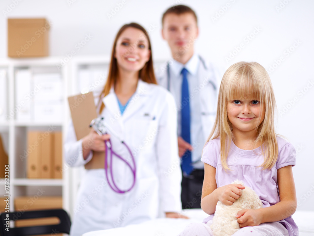 Female doctor examining child with stethoscope at surgery Female doctor examining child with stethoscope at surgery