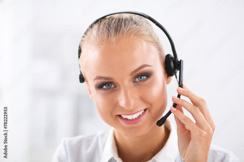 Close-up portrait of a customer service agent sitting at office Close-up portrait of a customer service agent sitting at office