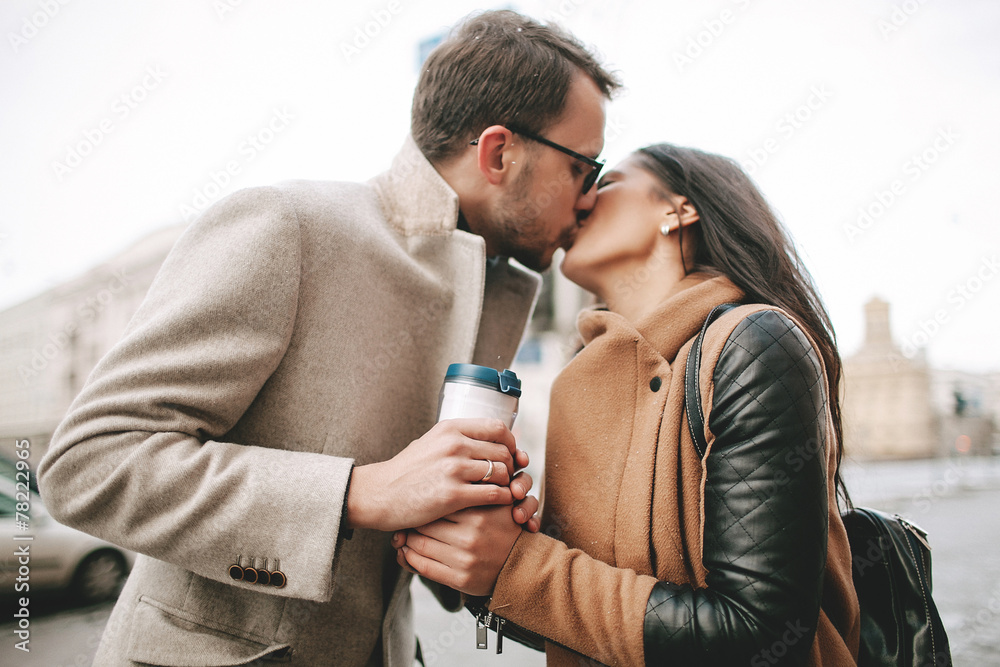 Young couple is kissing on the street Young couple is kissing on the street