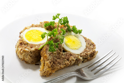 slices of meatloaf with boiled eggs for Easter