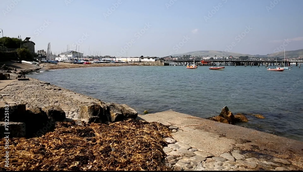 Swanage harbour and jetty Dorset England UK with sea and coast