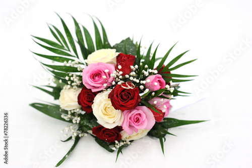 wedding rings on wedding bouquet