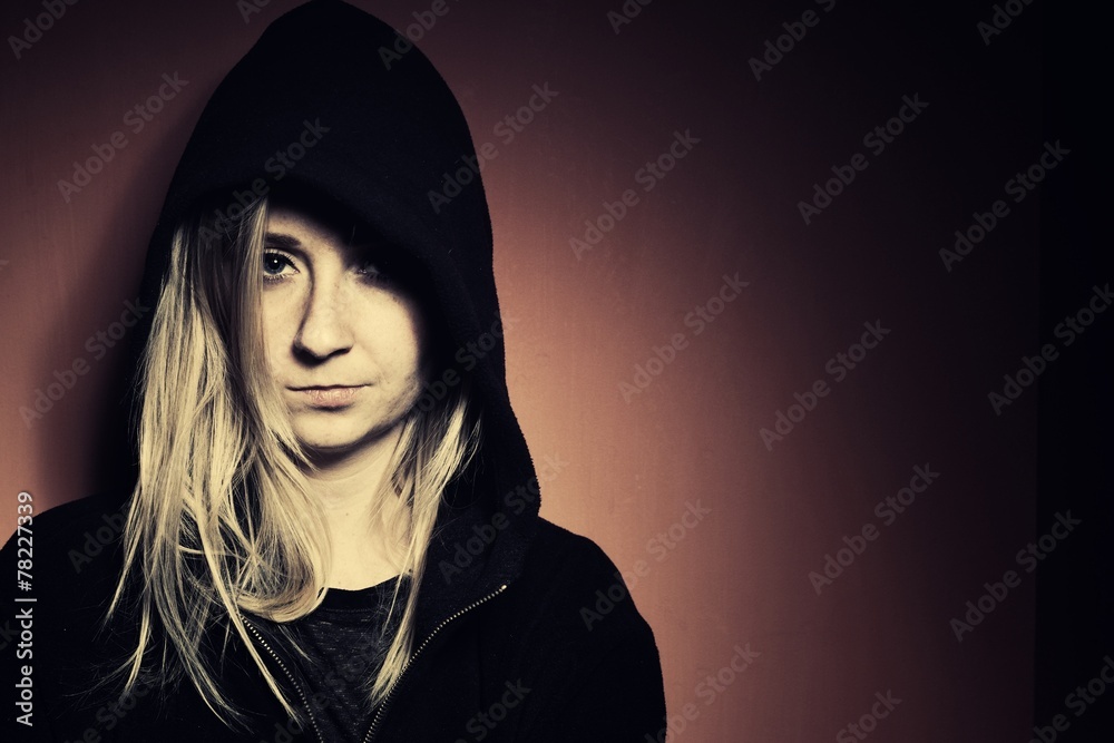 Rebellious teenager in a hoodie.