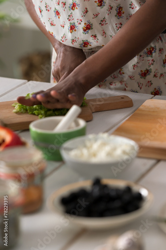 Young African Woman Cooking Salad