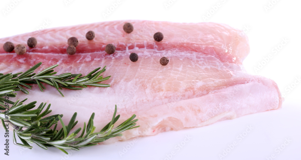 Pangasius fillet with pepper and rosemary sprigs isolated Pangasius fillet with pepper and rosemary sprigs isolated